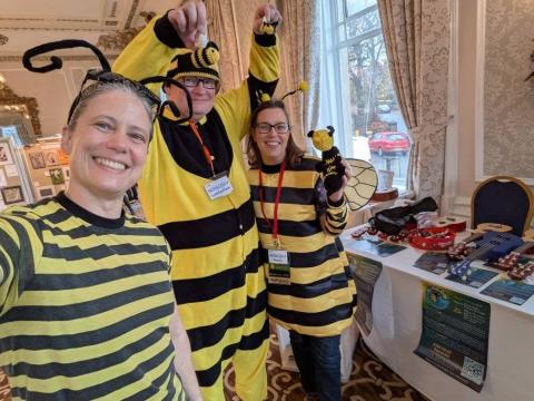FunCon committee members next to the FunCon table at Novacon