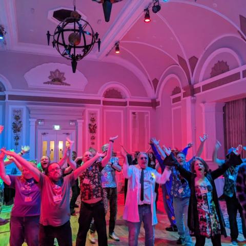 People grooving under the disco lights