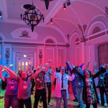 People grooving under the disco lights