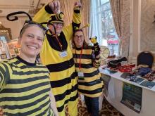 FunCon committee members next to the FunCon table at Novacon