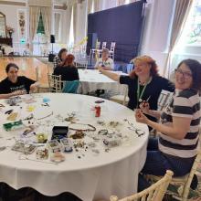 People working on making their own jewelery